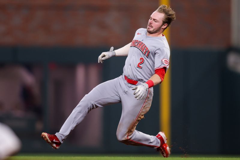 May 7, 2025; Atlanta, Georgia, USA; Cincinnati Reds designated hitter Gavin Lux (2) slides into second base against the Atlanta Braves in the sixth inning at Truist Park. Mandatory Credit: Brett Davis-Imagn Images