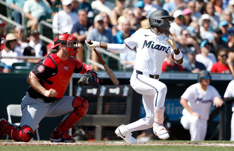 Feb 25, 2024; Jupiter, Florida, USA; Miami Marlins center fielder Jazz Chisholm Jr. (2) singles against the Washington Nationals in the second inning at Roger Dean Chevrolet Stadium. Mandatory Credit: Rhona Wise-USA TODAY Sports