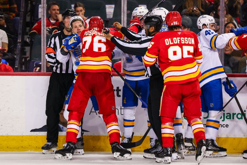 Mar 18, 2026; Calgary, Alberta, CAN; St. Louis Blues left wing Jake Neighbours (63) and Calgary Flames center Martin Pospisil (76) get into a scrum during the second period at Scotiabank Saddledome. Mandatory Credit: Sergei Belski-Imagn Images