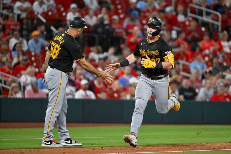 Jun 12, 2024; St. Louis, Missouri, USA;  Pittsburgh Pirates catcher Henry Davis (32) is congratulated by third base coach Mike Rabelo (58) after hitting a solo home run against the St. Louis Cardinals during the eighth inning at Busch Stadium. Mandatory Credit: Jeff Curry-USA TODAY Sports