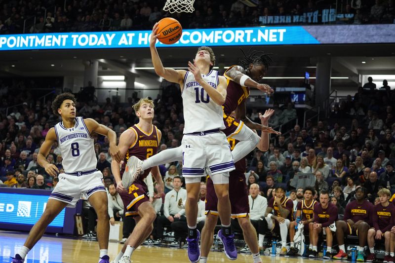 Jan 3, 2026; Evanston, Illinois, USA; Northwestern Wildcats guard Max Green (10) scores as Minnesota Golden Gophers guard Langston Reynolds (6) defends him during the first half at Welsh-Ryan Arena. Mandatory Credit: David Banks-Imagn Images