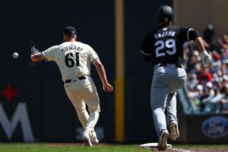 Apr 25, 2024; Minneapolis, Minnesota, USA; Minnesota Twins relief pitcher Brock Stewart (61) fields the ball for an out on a hit by Chicago White Sox Paul DeJong (29) during the eighth inning at Target Field. Mandatory Credit: Matt Krohn-USA TODAY Sports