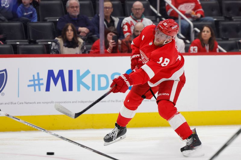 Jan 31, 2024; Detroit, Michigan, USA;  Detroit Red Wings center Andrew Copp (18) takes a shot in the second period against the Ottawa Senators at Little Caesars Arena. Mandatory Credit: Rick Osentoski-USA TODAY Sports