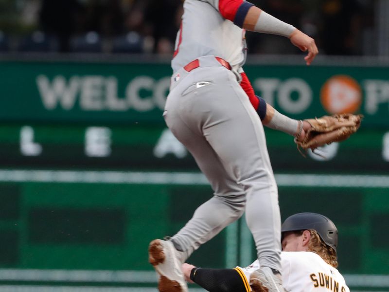 Jul 22, 2024; Pittsburgh, Pennsylvania, USA;  Pittsburgh Pirates center fielder Jack Suwinski (65) steals second base as St. Louis Cardinals shortstop Masyn Winn (0) attempts a tag during the fourth inning at PNC Park. Mandatory Credit: Charles LeClaire-USA TODAY Sports