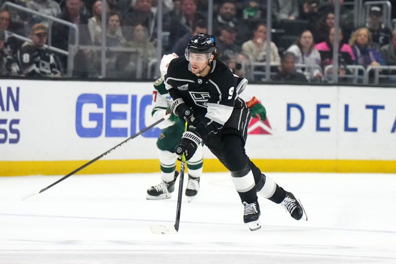 Apr 15, 2024; Los Angeles, California, USA; LA Kings right wing Adrian Kempe (9) skates with the puck against the Minnesota Wild in the second period at Crypto.com Arena. Mandatory Credit: Kirby Lee-USA TODAY Sports