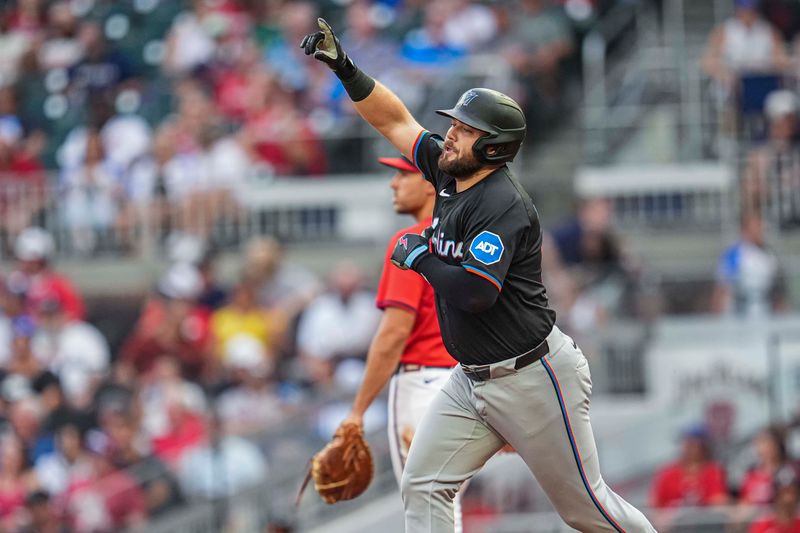 Aug 2, 2024; Cumberland, Georgia, USA; Miami Marlins designated hitter Jake Burger (36) reacts after hitting a home run against the Atlanta Braves during the third inning at Truist Park. Mandatory Credit: Dale Zanine-USA TODAY Sports