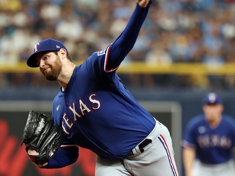 Oct 3, 2023; St. Petersburg, Florida, USA; Texas Rangers starting pitcher Jordan Montgomery (52) pitches during the first inning against the Tampa Bay Rays during game one of the Wildcard series for the 2023 MLB playoffs at Tropicana Field. Mandatory Credit: Kim Klement Neitzel-USA TODAY Sports