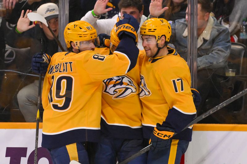 Dec 2, 2025; Nashville, Tennessee, USA;  Nashville Predators left wing Michael Bunting (58) celebrates with his teammates after scoring a goal against the Calgary Flames during the third period at Bridgestone Arena. Mandatory Credit: Steve Roberts-Imagn Images