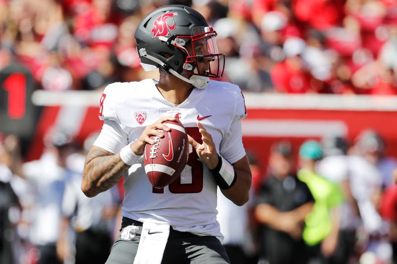 Sep 25, 2021; Salt Lake City, Utah, USA; Washington State Cougars quarterback Jarrett Guarantano (18) looks to pass in the first quarter against the Utah Utes at Rice-Eccles Stadium. Mandatory Credit: Jeffrey Swinger-USA TODAY Sports