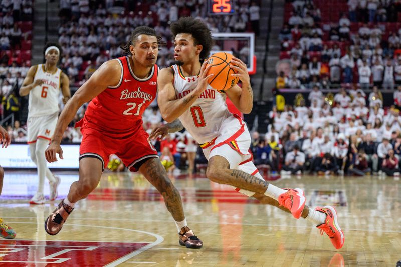 Dec 4, 2024; College Park, Maryland, USA; Maryland Terrapins guard Ja'Kobi Gillespie (0) drives to the basket against Ohio State Buckeyes forward Devin Royal (21) during the second half at Xfinity Center. Mandatory Credit: Reggie Hildred-Imagn Images