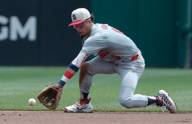 Jul 4, 2024; Pittsburgh, Pennsylvania, USA; St. Louis Cardinals shortstop Masyn Winn (0) fields a ground ball for an out against Pittsburgh Pirates left fielder Bryan Reynolds (not pictured) during the first inning at PNC Park. Mandatory Credit: Charles LeClaire-USA TODAY Sports