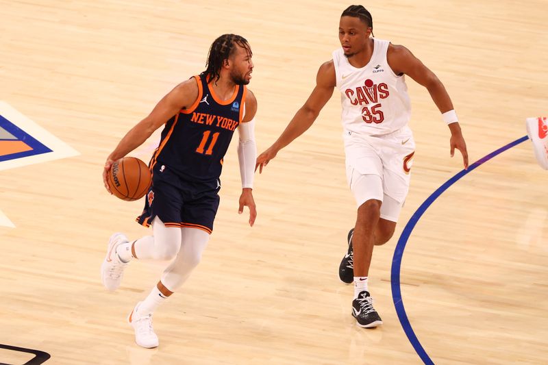 NEW YORK, NEW YORK - NOVEMBER 01: Jalen Brunson #11 of the New York Knicks carries the ball against Isaac Okoro #35 of the Cleveland Cavaliers during the first half at Madison Square Garden on November 01, 2023 in New York City. NOTE TO USER: User expressly acknowledges and agrees that, by downloading and or using this photograph, User is consenting to the terms and conditions of the Getty Images License Agreement. Mandatory Copyright Notice: Copyright 2023 NBAE (Photo by Mike Stobe/Getty Images)