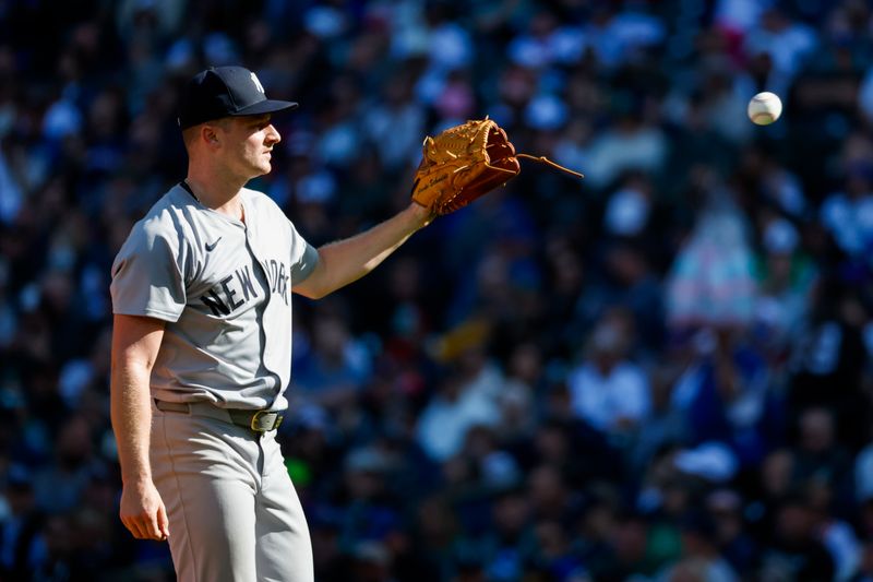 Sep 19, 2024; Seattle, Washington, USA; New York Yankees starting pitcher Clarke Schmidt (36) receives a new baseball during the fifth inning against the Seattle Mariners at T-Mobile Park. Mandatory Credit: Joe Nicholson-Imagn Images