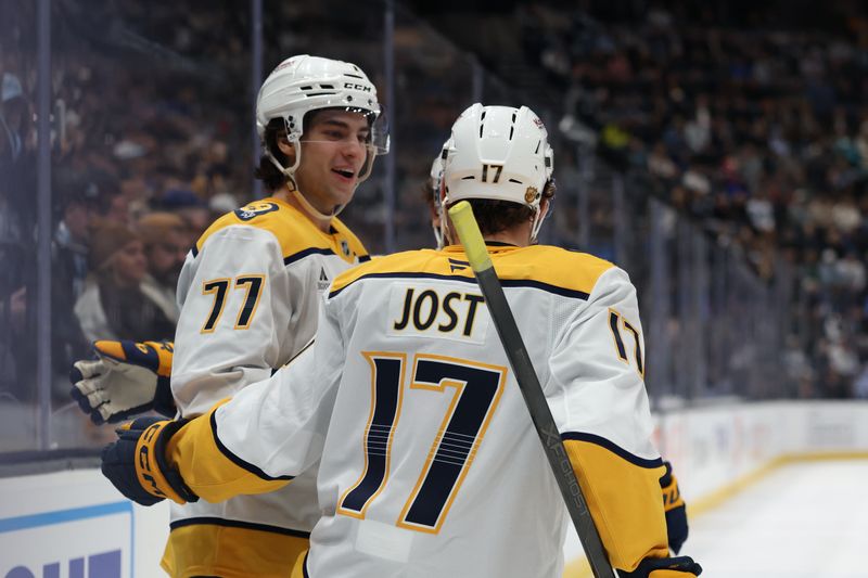Dec 29, 2025; Salt Lake City, Utah, USA; Nashville Predators right wing Luke Evangelista (77) celebrates a goal against the Utah Mammoth with center Tyson Jost (17) during the second period at Delta Center. Mandatory Credit: Rob Gray-Imagn Images