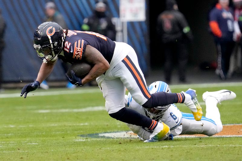 Chicago Bears wide receiver Velus Jones Jr. advances the ball as Detroit Lions safety Ifeatu Melifonwu makes the tackle during the second half of an NFL football game Sunday, Dec. 10, 2023, in Chicago. (AP Photo/Nam Y. Huh)