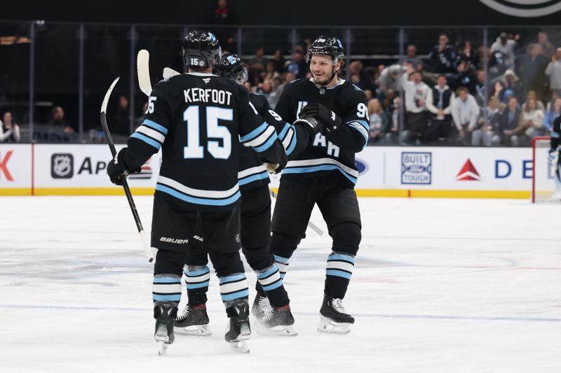 Nov 15, 2024; Salt Lake City, Utah, USA; Utah Hockey Club defenseman Mikhail Sergachev (98) celebrates scoring a goal against the Vegas Golden Knights during the second period at Delta Center. Mandatory Credit: Rob Gray-Imagn Images