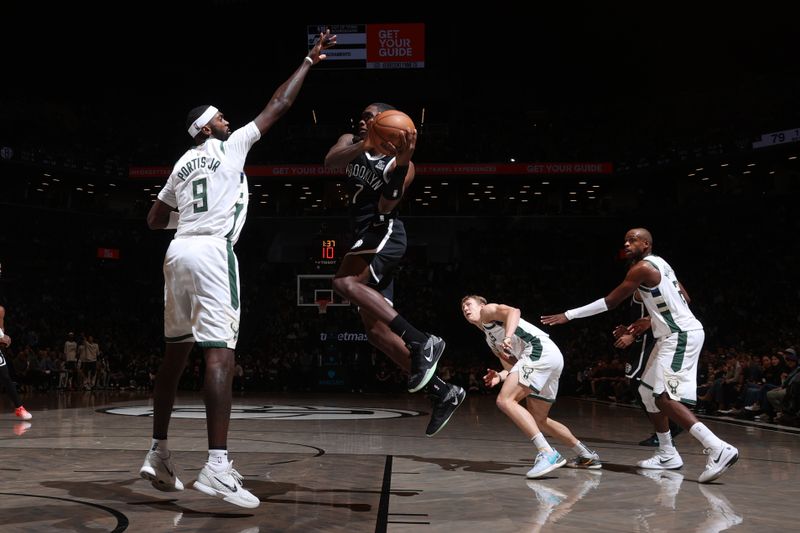 BROOKLYN, NY - DECEMBER 8: Shake Milton #7 of the Brooklyn Nets looks to pass the ball during the game against the Milwaukee Bucks on December 8, 2024 at Barclays Center in Brooklyn, New York. NOTE TO USER: User expressly acknowledges and agrees that, by downloading and or using this Photograph, user is consenting to the terms and conditions of the Getty Images License Agreement. Mandatory Copyright Notice: Copyright 2024 NBAE (Photo by Nathaniel S. Butler/NBAE via Getty Images)