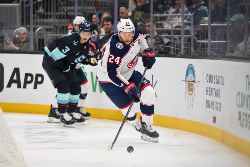 Nov 12, 2024; Seattle, Washington, USA; Columbus Blue Jackets right wing Mathieu Olivier (24) plays the puck during the second period against the Seattle Kraken at Climate Pledge Arena. Mandatory Credit: Steven Bisig-Imagn Images