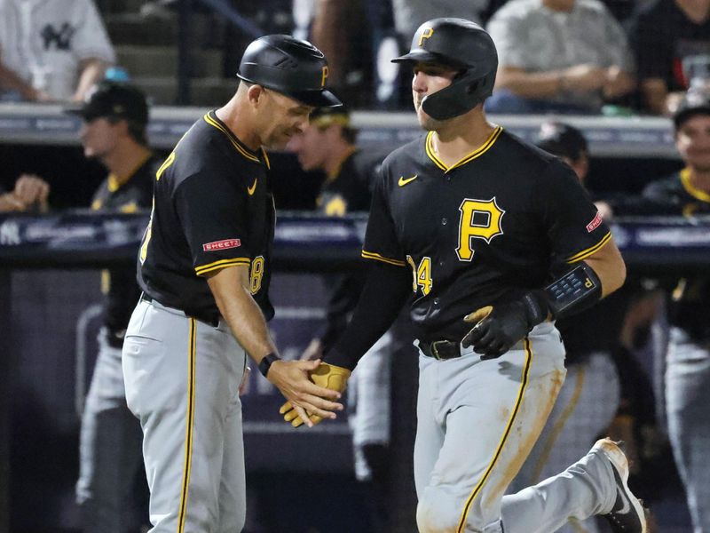 Mar 3, 2025; Tampa, Florida, USA;  Pittsburgh Pirates catcher Joey Bart (14) is congratulated as he runs around the bases after he hit a two-run home run against the New York Yankees during the third inning at George M. Steinbrenner Field. Mandatory Credit: Kim Klement Neitzel-Imagn Images