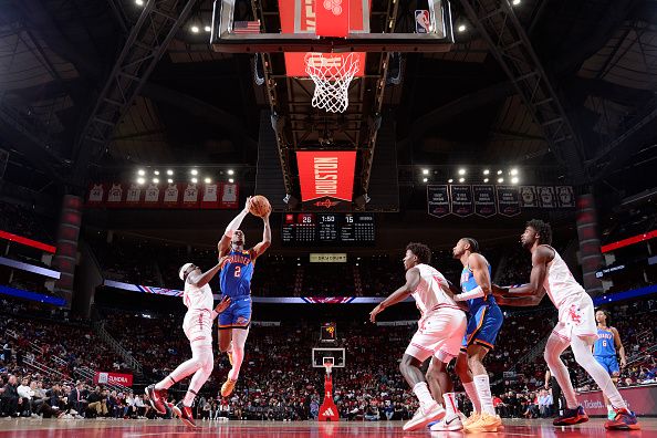 HOUSTON, TX - DECEMBER 6:   Shai Gilgeous-Alexander #2 of the Oklahoma City Thunder drives to the basket during the game against the Houston Rockets on December 6, 2023 at the Toyota Center in Houston, Texas. NOTE TO USER: User expressly acknowledges and agrees that, by downloading and or using this photograph, User is consenting to the terms and conditions of the Getty Images License Agreement. Mandatory Copyright Notice: Copyright 2023 NBAE (Photo by Michael Gonzales/NBAE via Getty Images)