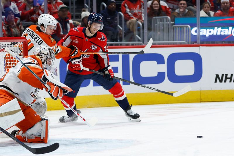 Jan 14, 2025; Washington, District of Columbia, USA; Washington Capitals center Lars Eller (20) and Anaheim Ducks right wing Sam Colangelo (64) battle for the puck in front of Ducks goaltender John Gibson (36) in the first period at Capital One Arena. Mandatory Credit: Geoff Burke-Imagn Images