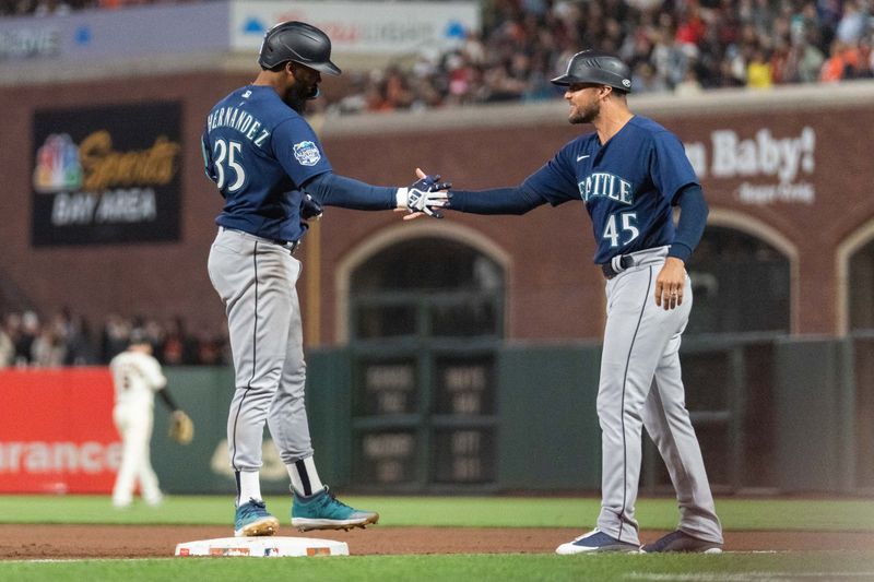 Jul 3, 2023; San Francisco, California, USA;  Seattle Mariners right fielder Teoscar Hernandez (35) celebrates with first base coach Kristopher Negr  n (45) during the ninth inning against the San Francisco Giants at Oracle Park. Mandatory Credit: Stan Szeto-USA TODAY Sports