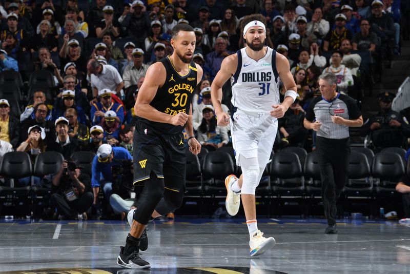 SAN FRANCISCO, CA - NOVEMBER 12: Stephen Curry #30 of the Golden State Warriors and Klay Thompson #31 of the Dallas Mavericks run up the court during the game during the Emirates NBA Cup game on November 12, 2024 at Chase Center in San Francisco, California. NOTE TO USER: User expressly acknowledges and agrees that, by downloading and or using this photograph, user is consenting to the terms and conditions of Getty Images License Agreement. Mandatory Copyright Notice: Copyright 2024 NBAE (Photo by Noah Graham/NBAE via Getty Images)