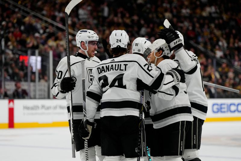 Dec 28, 2023; Las Vegas, Nevada, USA; The Los Angeles Kings celebrate after scoring a goal against the Vegas Golden Knights during the third period at T-Mobile Arena. Mandatory Credit: Lucas Peltier-USA TODAY Sports