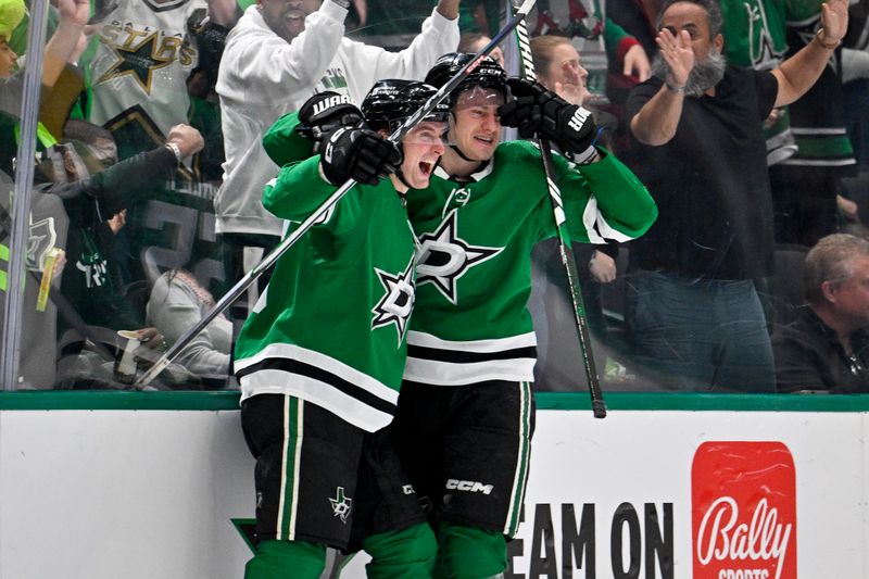 Dec 21, 2023; Dallas, Texas, USA; Dallas Stars defenseman Thomas Harley (55) and center Roope Hintz (24) celebrate after Harley scores the game tying goal against the Vancouver Canucks during the third period at the American Airlines Center. Mandatory Credit: Jerome Miron-USA TODAY Sports