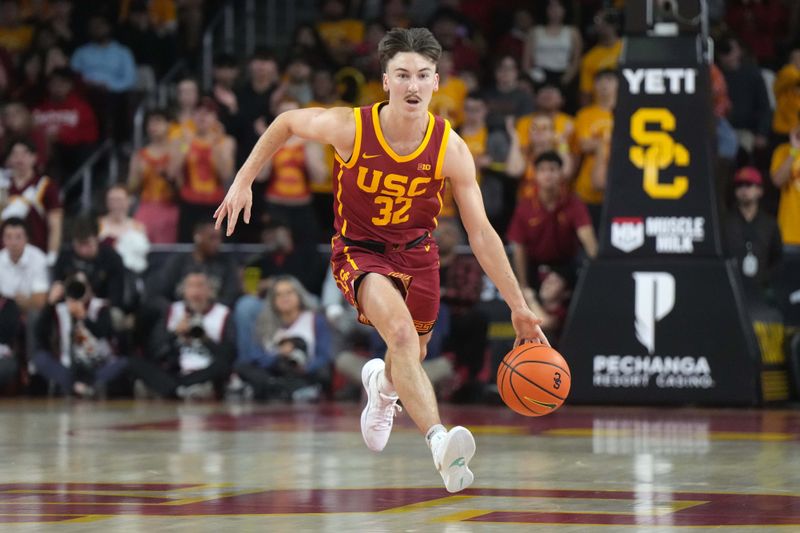 Jan 27, 2025; Los Angeles, California, USA; Southern California Trojans guard Clark Slajchert (32) dribbles the ball against the UCLA Bruins in the second half at the Galen Center. Mandatory Credit: Kirby Lee-Imagn Images