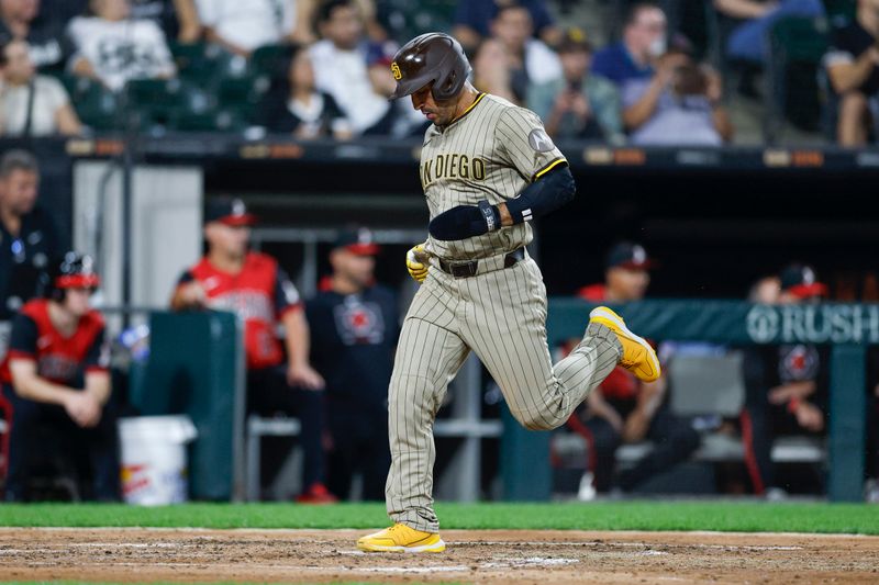 Sep 19, 2025; Chicago, Illinois, USA; San Diego Padres left fielder Ramon Laureano (5) scores against the Chicago White Sox during the fourth inning at Rate Field. Mandatory Credit: Kamil Krzaczynski-Imagn Images