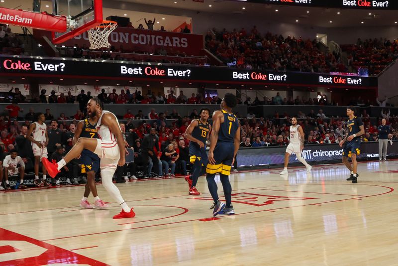 Jan 15, 2025; Houston, Texas, USA;  Houston Cougars forward J'Wan Roberts (13) reacts to his dunk against the West Virginia Mountaineers in the second half at Fertitta Center. Mandatory Credit: Thomas Shea-Imagn Images