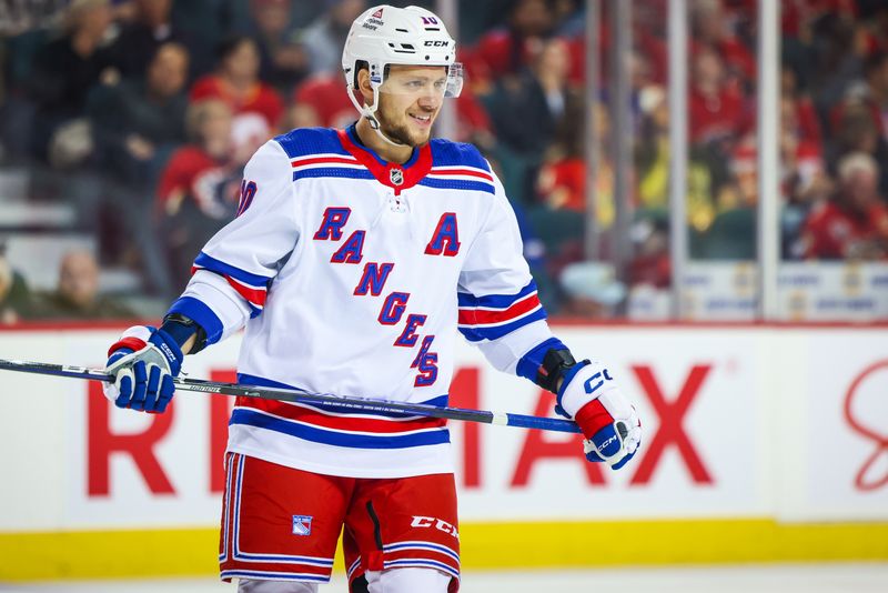 Oct 24, 2023; Calgary, Alberta, CAN; New York Rangers left wing Artemi Panarin (10) reacts during the second period against the Calgary Flames at Scotiabank Saddledome. Mandatory Credit: Sergei Belski-USA TODAY Sports