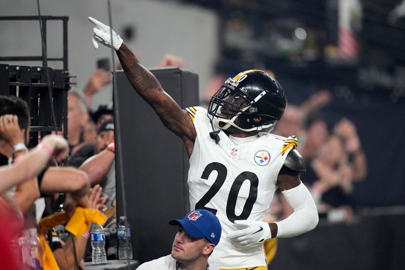 Pittsburgh Steelers cornerback Patrick Peterson (20) celebrates after intercepting a pass during the second half of an NFL football game against the Las Vegas Raiders Sunday, Sept. 24, 2023, in Las Vegas. (AP Photo/Mark J. Terrill)