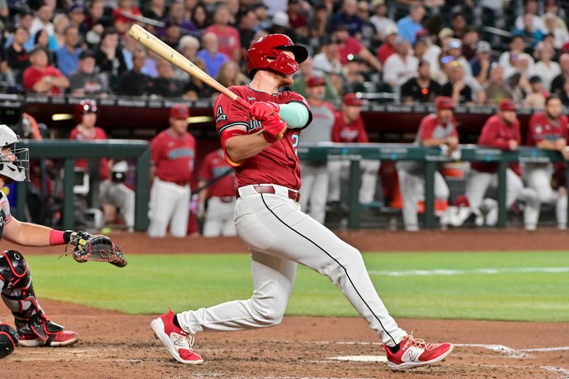 May 15, 2024; Phoenix, Arizona, USA;  Arizona Diamondbacks outfielder Pavin Smith (26) hits a double in the eighth inning against the Cincinnati Reds at Chase Field. Mandatory Credit: Matt Kartozian-USA TODAY Sports