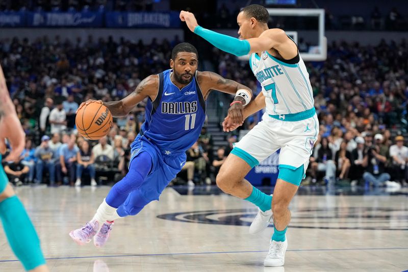 DALLAS, TEXAS - NOVEMBER 05: Kyrie Irving #11 of the Dallas Mavericks drives with the ball as Bryce McGowens #7 of the Charlotte Hornets defends during the first half at American Airlines Center on November 05, 2023 in Dallas, Texas. NOTE TO USER: User expressly acknowledges and agrees that, by downloading and or using this photograph, User is consenting to the terms and conditions of the Getty Images License Agreement. (Photo by Sam Hodde/Getty Images)