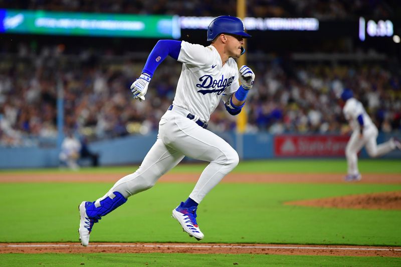 Aug 15, 2023; Los Angeles, California, USA; Los Angeles Dodgers pinch hitter Enrique Hernandez (8) runs after hitting a two run RBI single against the Milwaukee Brewers during the sixth inning at Dodger Stadium. Mandatory Credit: Gary A. Vasquez-USA TODAY Sports