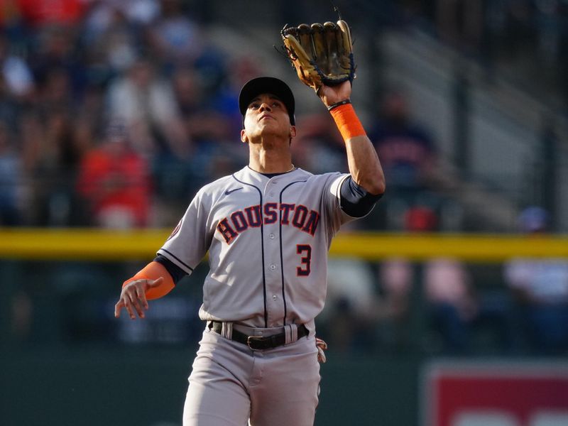 Jul 18, 2023; Denver, Colorado, USA; Houston Astros shortstop Jeremy Pena (3) fields the ball in the first inning against the Colorado Rockies at Coors Field. Mandatory Credit: Ron Chenoy-USA TODAY Sports