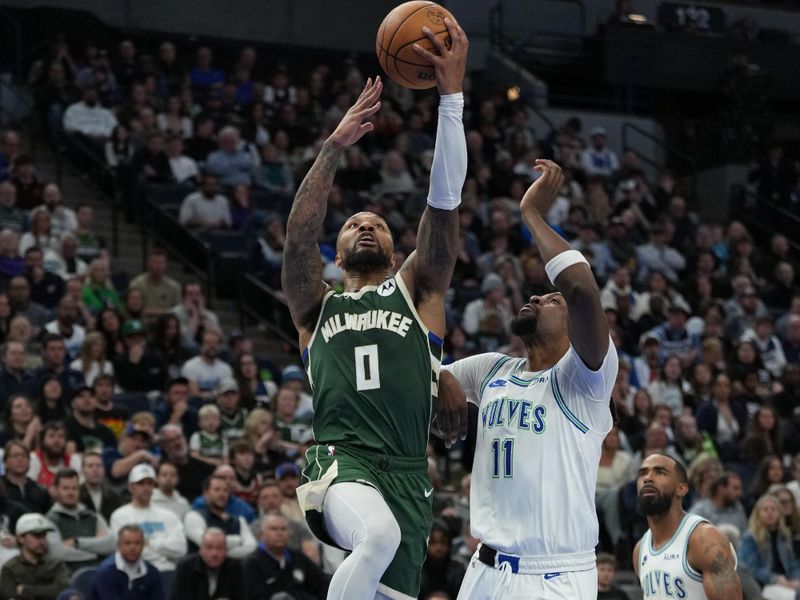 MINNEAPOLIS, MN -  FEBRUARY 23: Damian Lillard #0 of the Milwaukee Bucks drives to the basket during the game against the Minnesota Timberwolves on February 23, 2024 at Target Center in Minneapolis, Minnesota. NOTE TO USER: User expressly acknowledges and agrees that, by downloading and or using this Photograph, user is consenting to the terms and conditions of the Getty Images License Agreement. Mandatory Copyright Notice: Copyright 2024 NBAE (Photo by Jordan Johnson/NBAE via Getty Images)