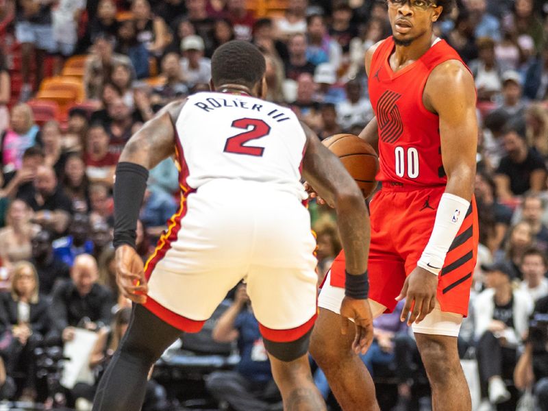 MIAMI, FLORIDA - MARCH 29: Scoot Henderson #00 of the Portland Trail Blazers in action against Terry Rosier III #2 of the Miami Heat	 during the first half at the Kaseya Center on March 29, 2024 in Miami, Florida. NOTE TO USER: User expressly acknowledges and agrees that, by downloading and or using this photograph, User is consenting to the terms and conditions of the Getty Images License Agreement.  (Photo by Lauren Sopourn/Getty Images)