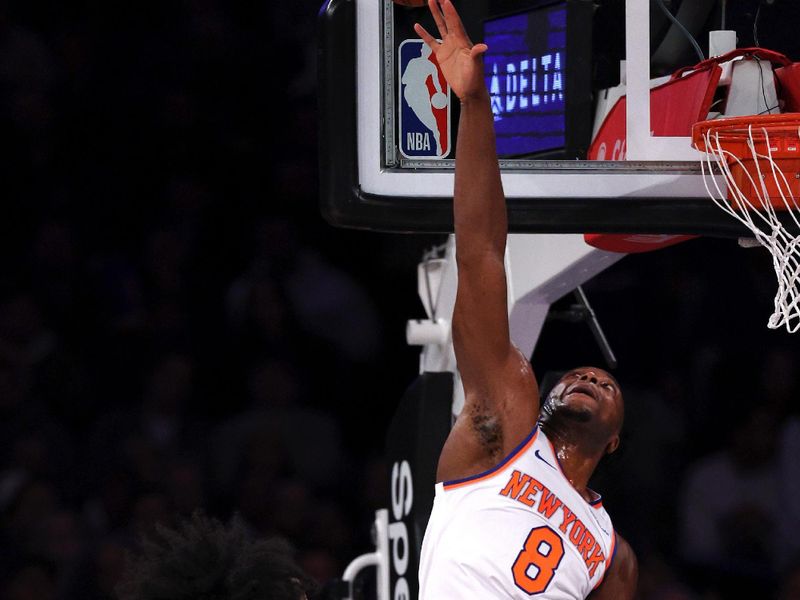 NEW YORK, NEW YORK - NOVEMBER 13: OG Anunoby #8 of the New York Knicks blocks a shot attempt by Coby White #0 of the Chicago Bulls during the first quarter at Madison Square Garden on November 13, 2024 in New York City. NOTE TO USER: User expressly acknowledges and agrees that, by downloading and or using this photograph, User is consenting to the terms and conditions of the Getty Images License Agreement. (Photo by Elsa/Getty Images)