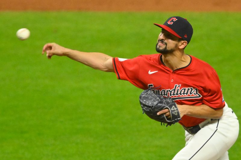 Sep 17, 2024; Cleveland, Ohio, USA; Cleveland Guardians relief pitcher Nick Sandlin (52) delivers a pitch in the eighth inning against the Minnesota Twins at Progressive Field. Mandatory Credit: David Richard-Imagn Images