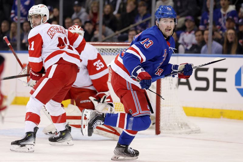 Nov 29, 2023; New York, New York, USA; New York Rangers left wing Alexis Lafreniere (13) skates against Detroit Red Wings defenseman Shayne Gostisbehere (41) and goaltender Ville Husso (35) during the first period at Madison Square Garden. Mandatory Credit: Brad Penner-USA TODAY Sports