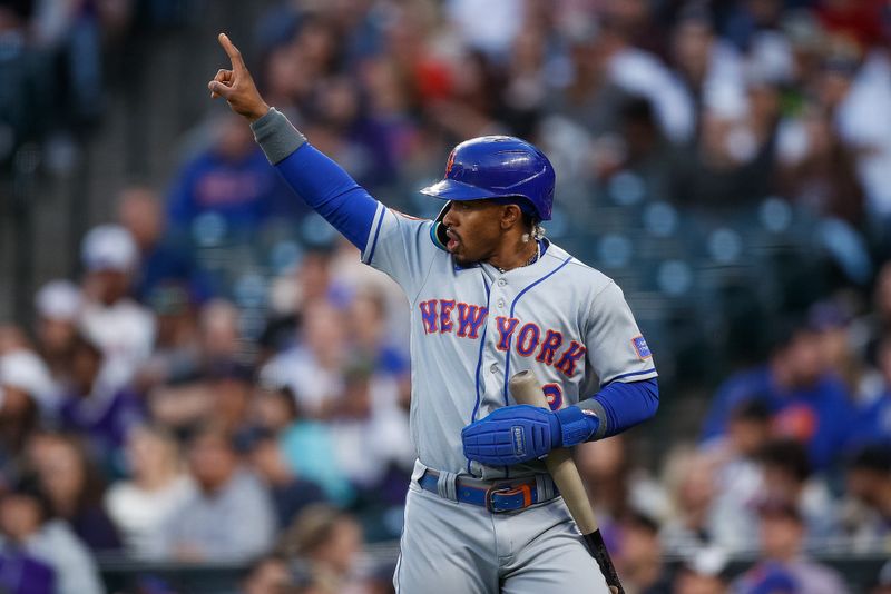 May 26, 2023; Denver, Colorado, USA; New York Mets shortstop Francisco Lindor (12) reacts after scoring on an RBI in the fifth inning against the Colorado Rockies at Coors Field. Mandatory Credit: Isaiah J. Downing-USA TODAY Sports