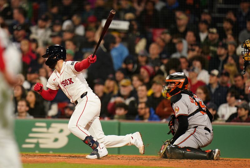 Apr 10, 2024; Boston, Massachusetts, USA; Boston Red Sox catcher Connor Wong (12) singled to right field to drive in two runs against the Baltimore Orioles in the fourth inning at Fenway Park. Mandatory Credit: David Butler II-USA TODAY Sports