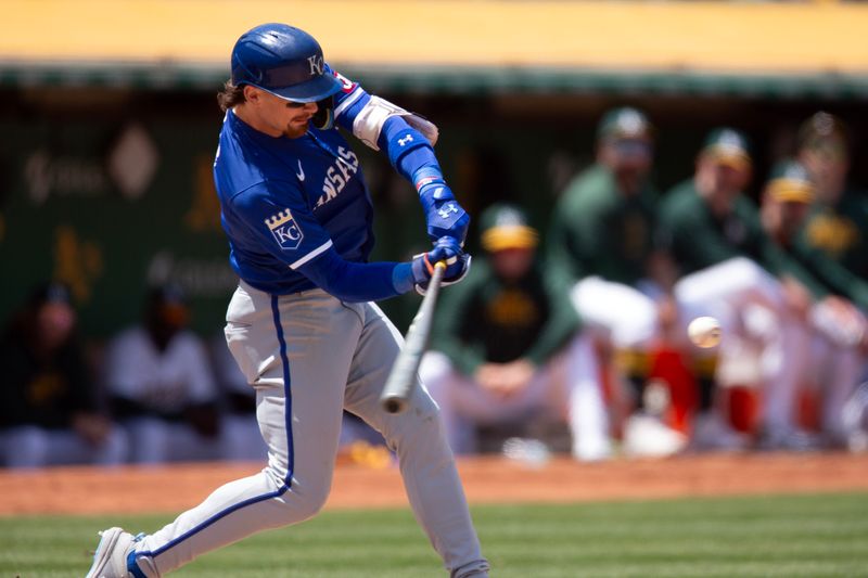 Jun 20, 2024; Oakland, California, USA; Kansas City Royals shortstop Bobby Witt Jr. (7) hits a home run against the Oakland Athletics during the eighth inning at Oakland-Alameda County Coliseum. Mandatory Credit: D. Ross Cameron-USA TODAY Sports