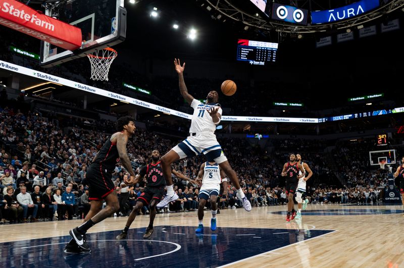 MINNEAPOLIS, MINNESOTA - APRIL 3: Naz Reid #11 of the Minnesota Timberwolves has the ball knocked in the third quarter of the game against the Toronto Raptors at Target Center on April 3, 2024 in Minneapolis, Minnesota. NOTE TO USER: User expressly acknowledges and agrees that, by downloading and or using this photograph, User is consenting to the terms and conditions of the Getty Images License Agreement. (Photo by Stephen Maturen/Getty Images)