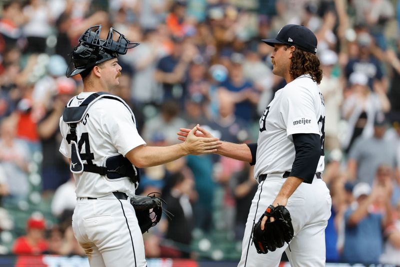 Apr 28, 2024; Detroit, Michigan, USA;  Detroit Tigers catcher Jake Rogers (34) and relief pitcher Jason Foley (68) celebrate after defeating the Kansas City Royals at Comerica Park. Mandatory Credit: Rick Osentoski-USA TODAY Sports