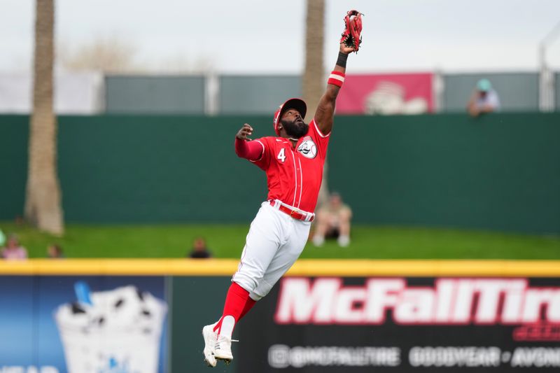 Feb 26, 2024; Goodyear, AZ, USA; Cincinnati Reds second baseman Josh Harrison leaps to catch a line drive for an out in the first inning during a MLB spring training baseball game against the Seattle Mariners, Monday, Feb. 26, 2024, at Goodyear Ballpark in Goodyear, Ariz. Mandatory Credit: Kareem Elgazzar-USA TODAY Sports