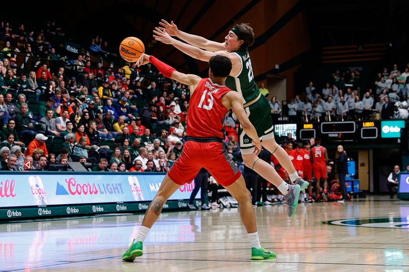 Mar 3, 2023; Fort Collins, Colorado, USA; New Mexico Lobos guard Javonte Johnson (13) and Colorado State Rams guard Joe Palmer (20) battle for the ball in the second half at Moby Arena. Mandatory Credit: Isaiah J. Downing-USA TODAY Sports